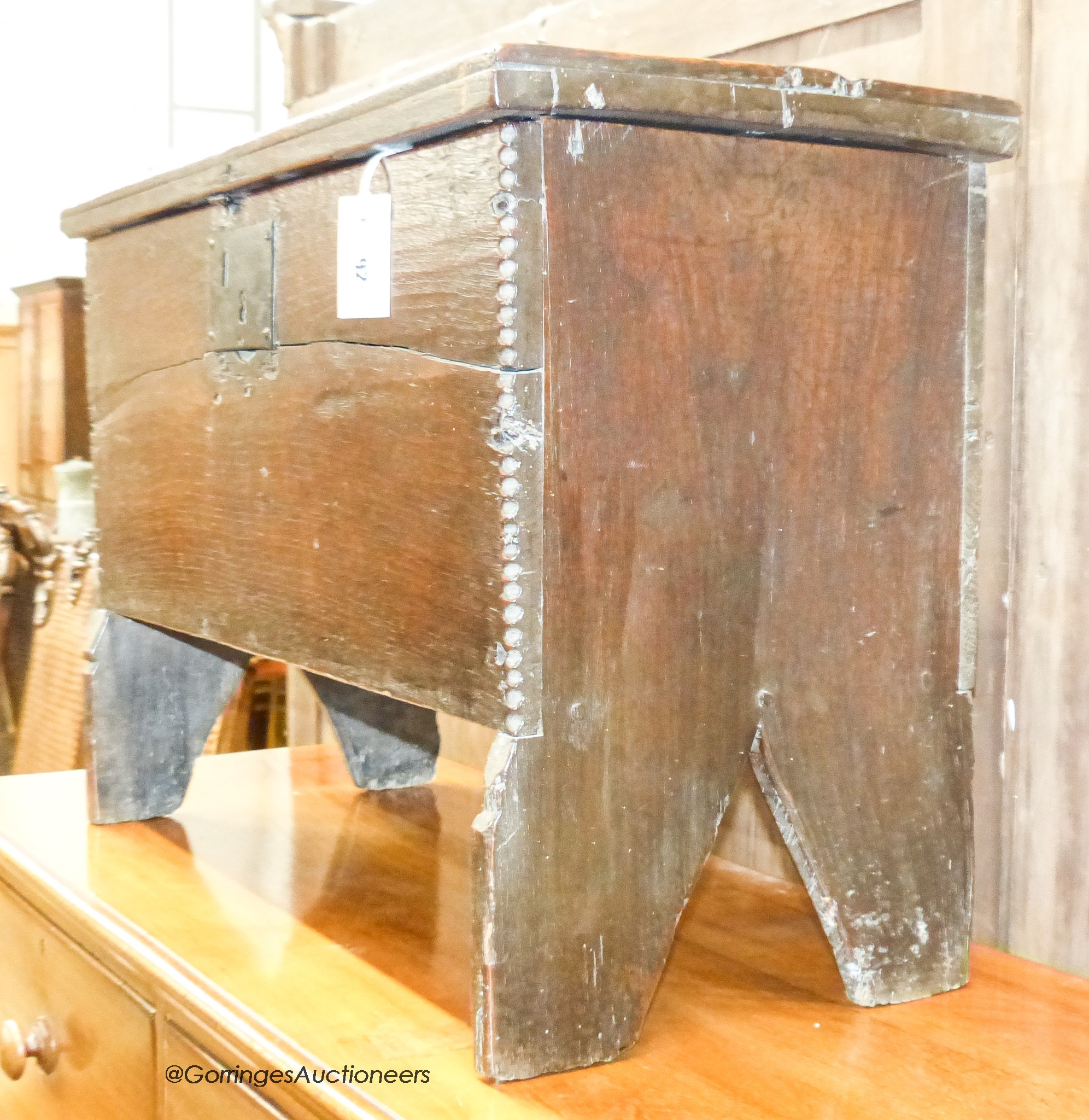 A 17th century oak six-plank coffer of small proportions